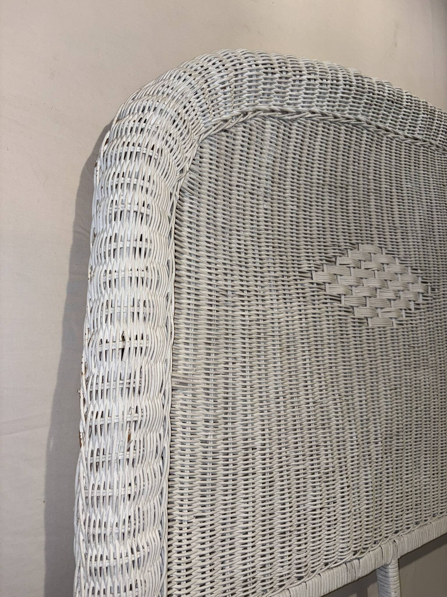 Vintage headboard in woven white rattan