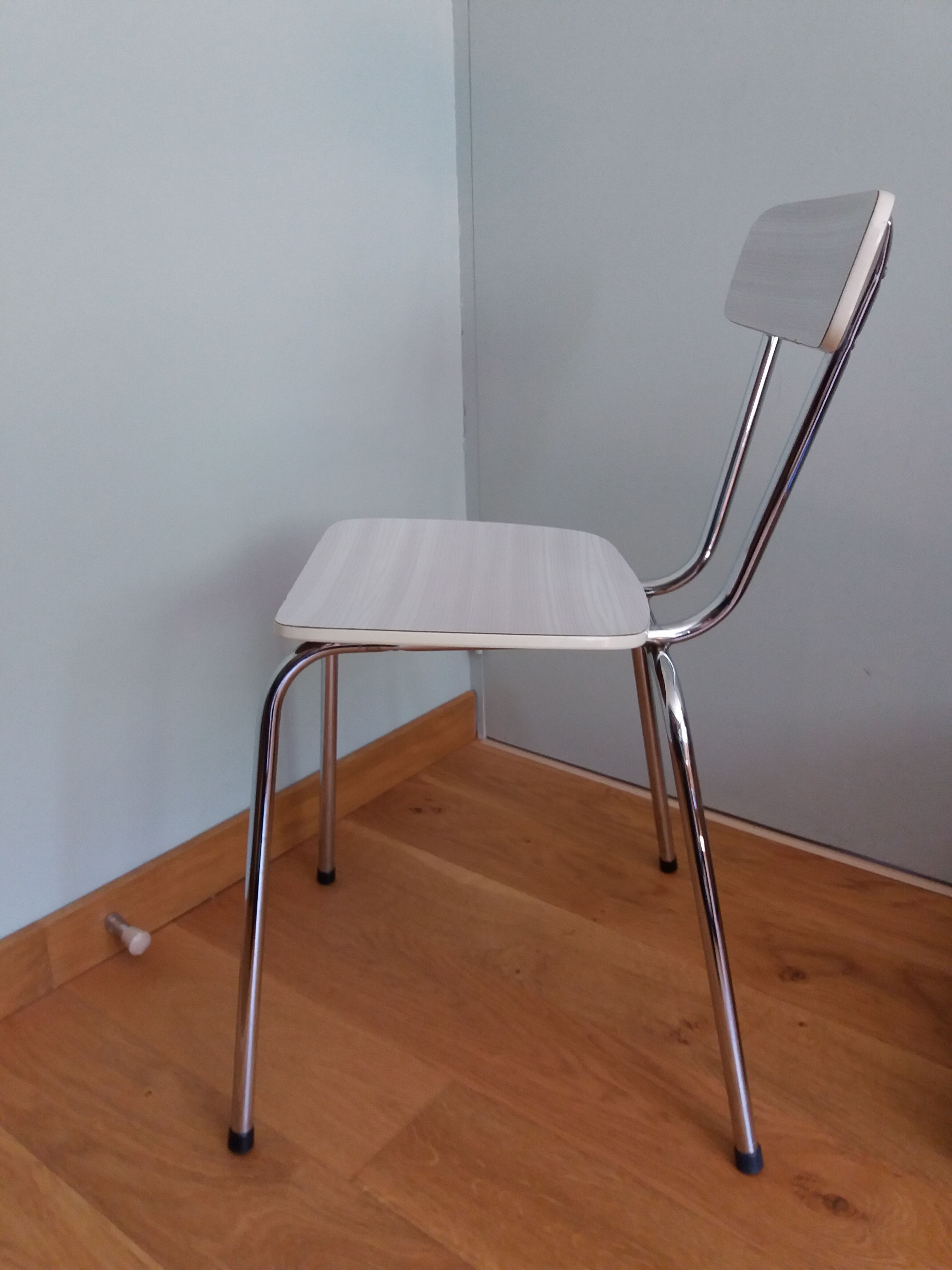 Chrome metal chair and formica white striped gray