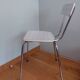 Chrome metal chair and formica white striped gray