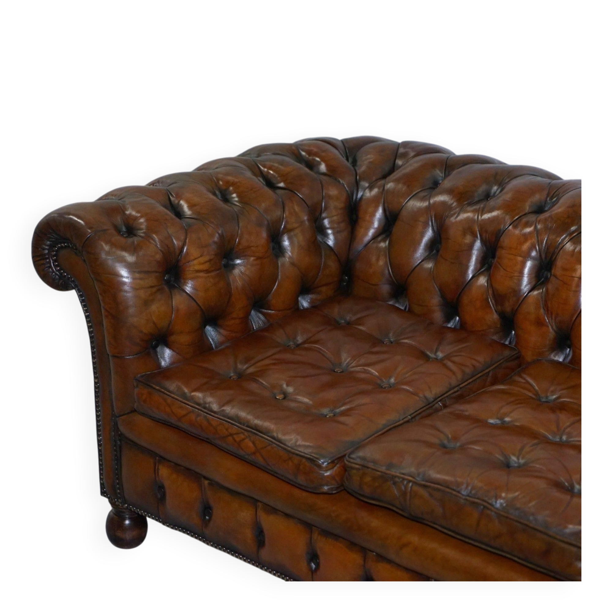 Restored vintage leather Chesterfield canapé in Thomas Chippendale style.
