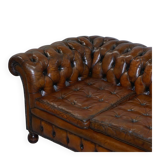 Restored vintage leather Chesterfield canapé in Thomas Chippendale style.