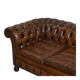 Restored vintage leather Chesterfield canapé in Thomas Chippendale style.