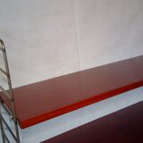 String shelf by Nisse Strinning with three mahogany shelves. Gungrey metal sides.