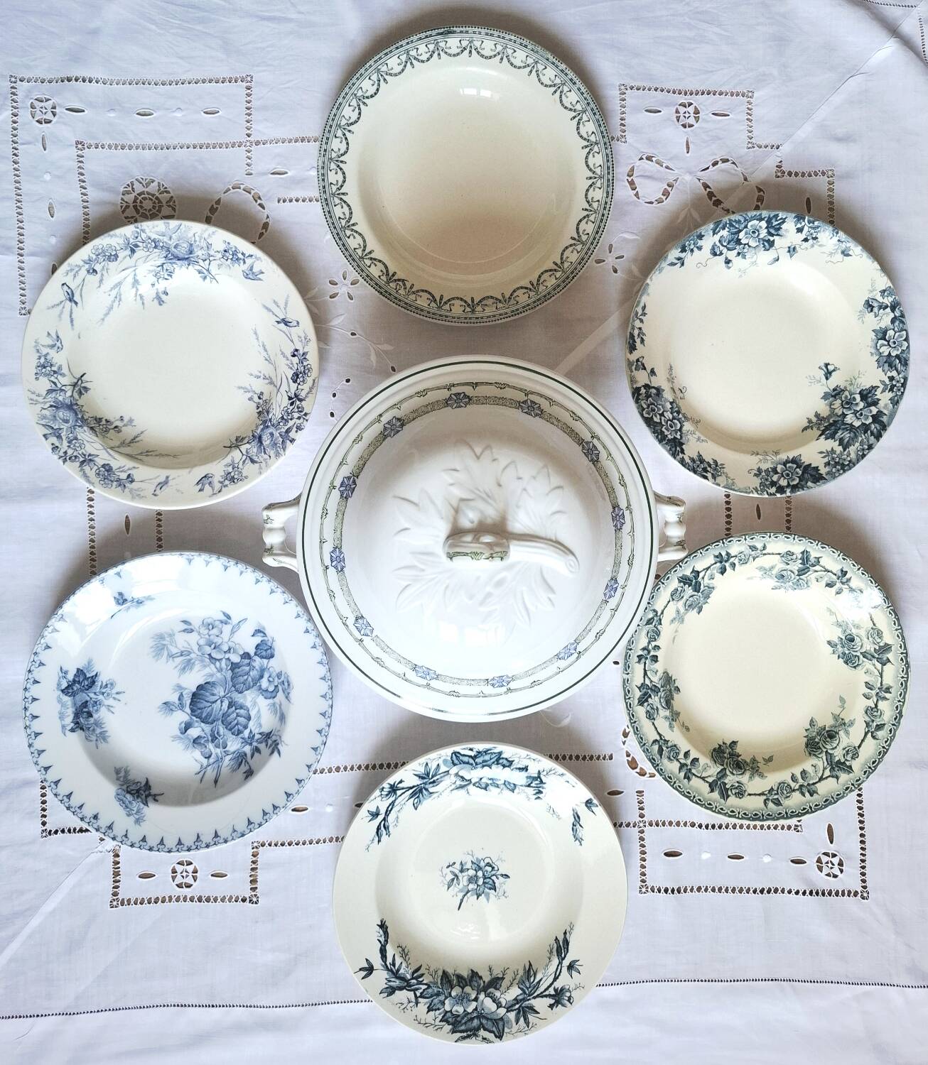 Antique deep plates in ironstone with a soup tureen.