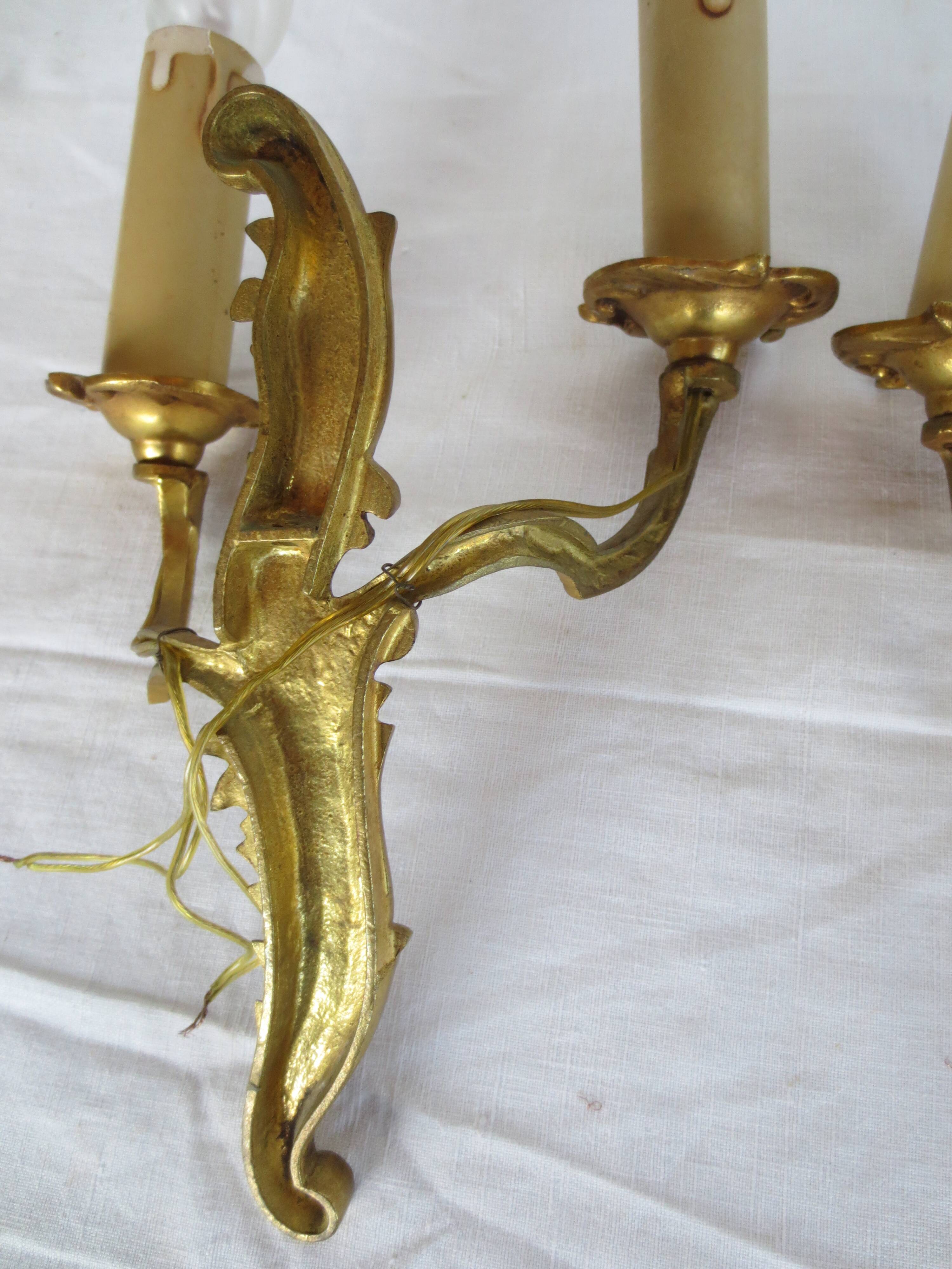 Pair of double wall lights in gilded bronze