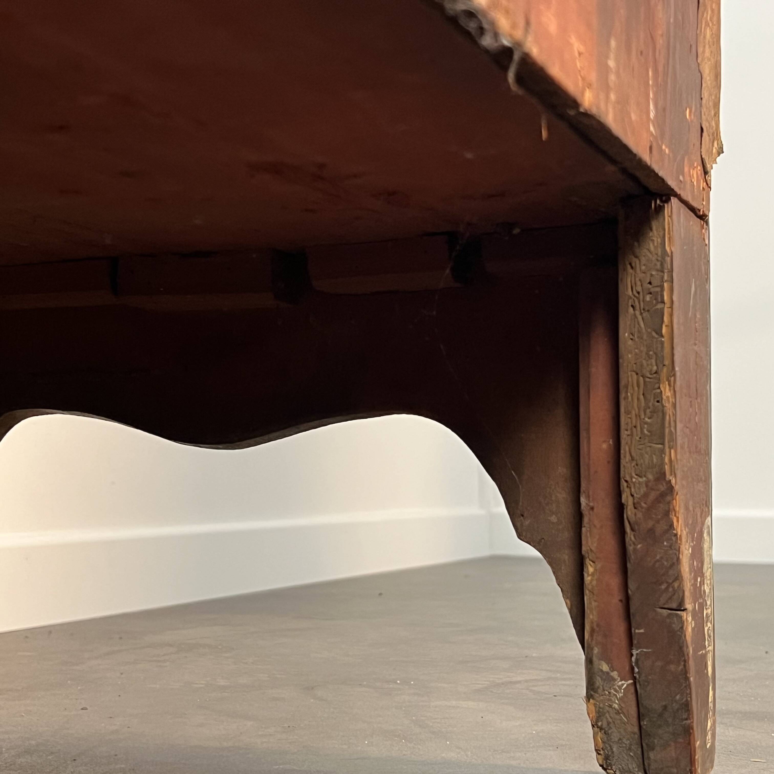 English commode from the George III Regency period, bombe shape in mahogany veneer.