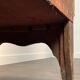 English commode from the George III Regency period, bombe shape in mahogany veneer.