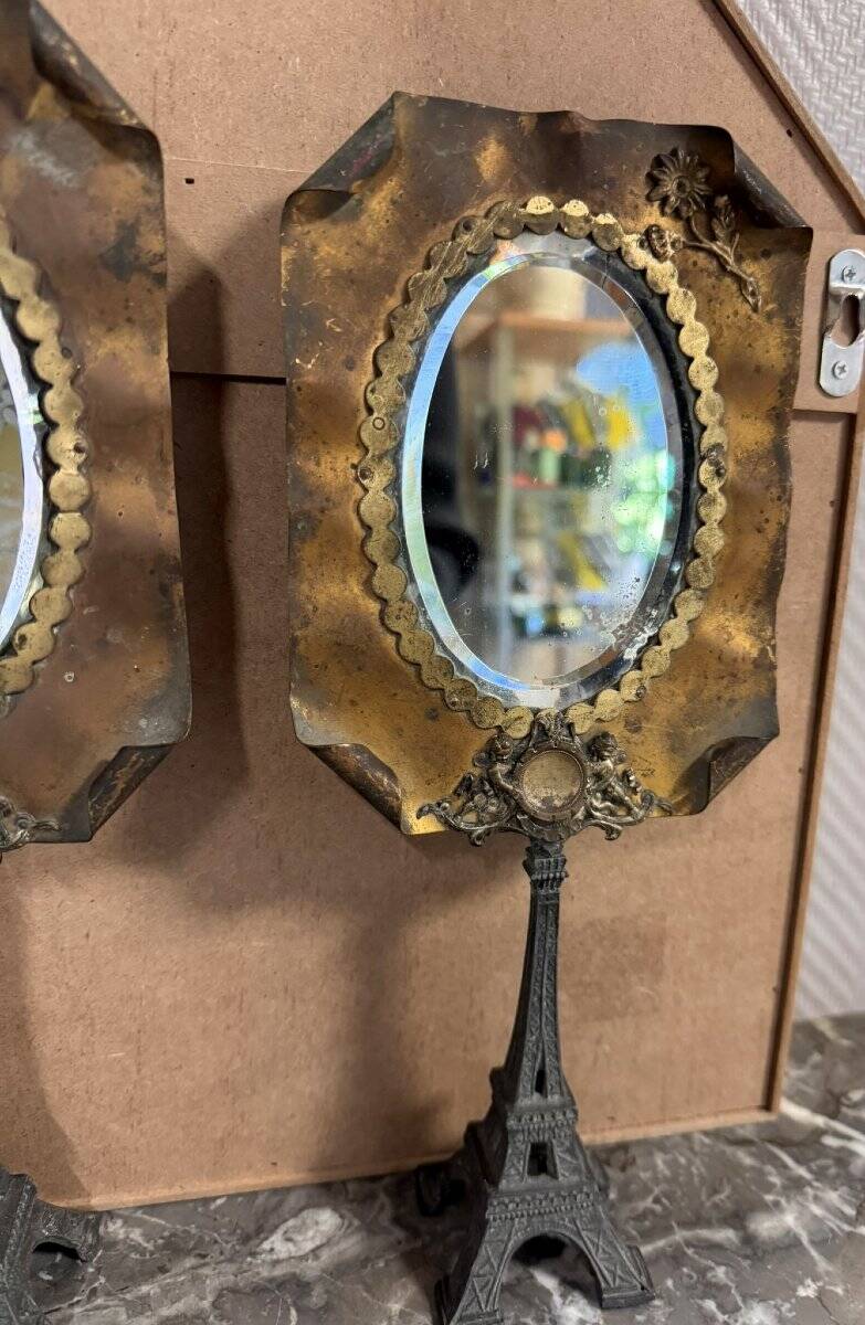 Pair of brass mirrors from the Art Deco period perched on the Eiffel Tower.