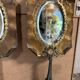 Pair of brass mirrors from the Art Deco period perched on the Eiffel Tower.