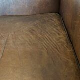 Paire de fauteuils en cuir de mouton