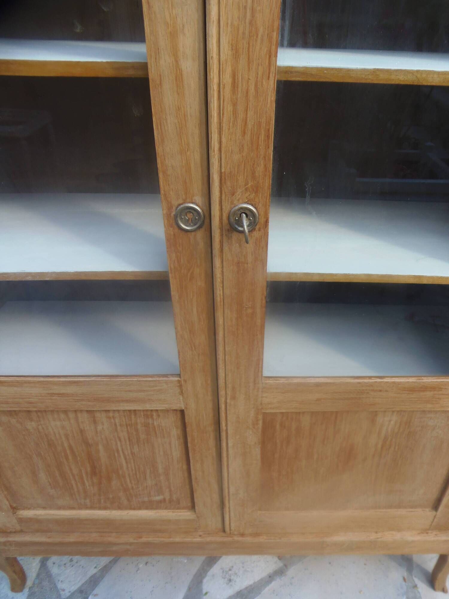 Charming vintage display cabinet from the 1950s in natural wood.
