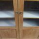Charming vintage display cabinet from the 1950s in natural wood.