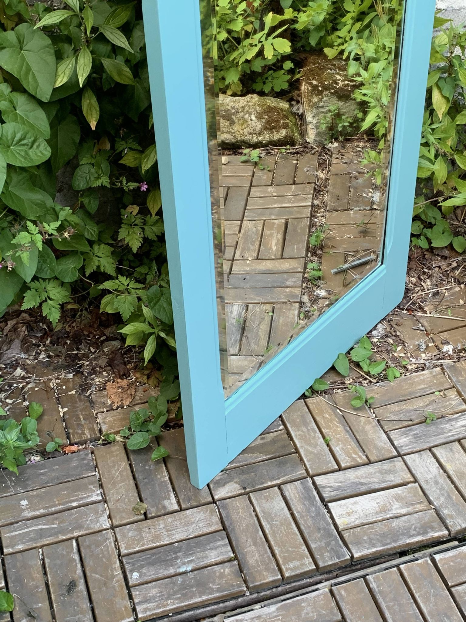 Beveled mirror on turquoise Parisian door