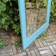Beveled mirror on turquoise Parisian door