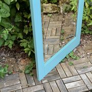 Beveled mirror on turquoise Parisian door
