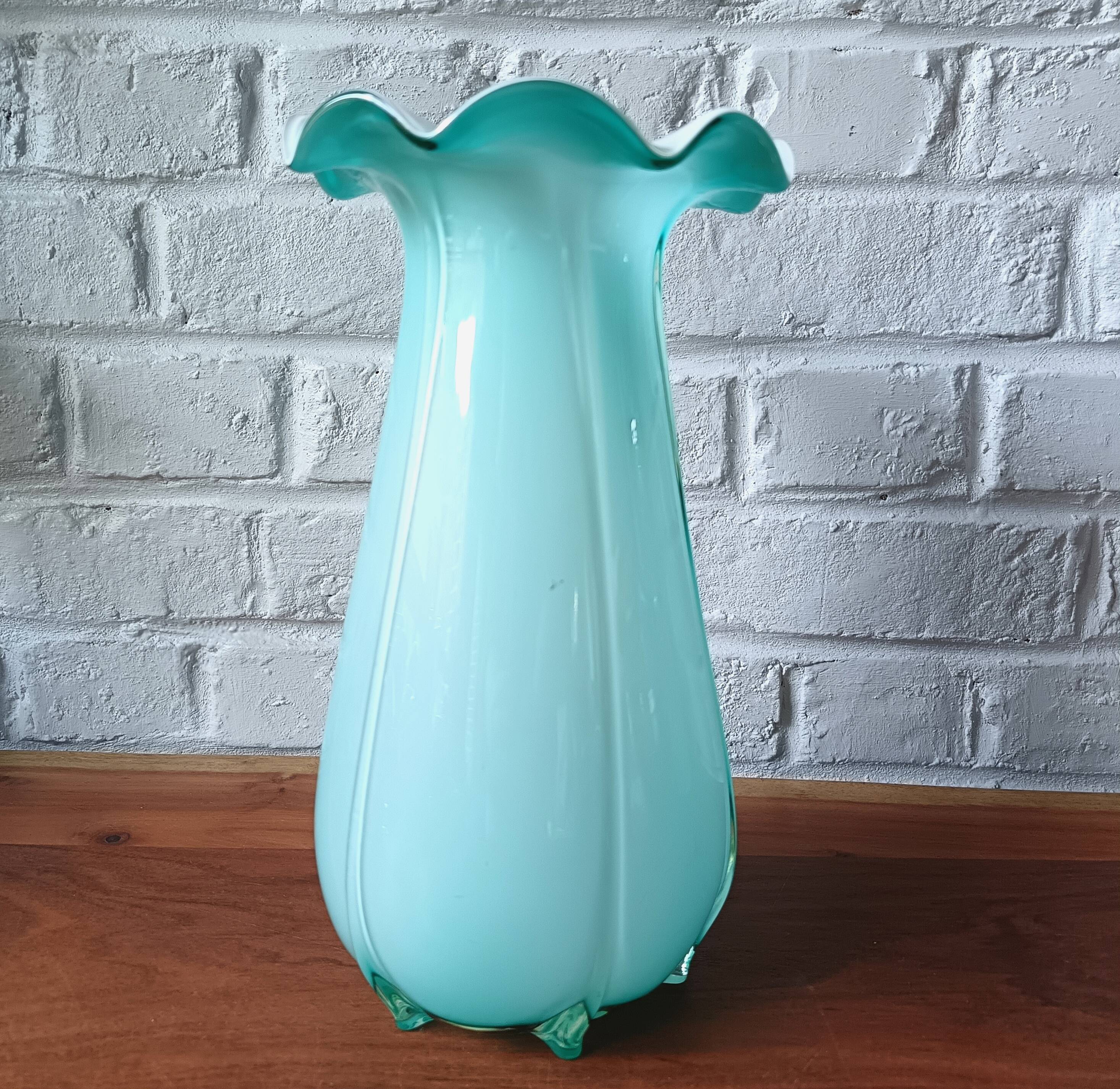 Large light blue opaline vase with a wavy neck.