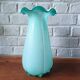 Large light blue opaline vase with a wavy neck.