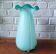 Large light blue opaline vase with a wavy neck.