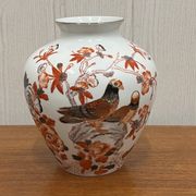 Vase decorated with birds and butterflies