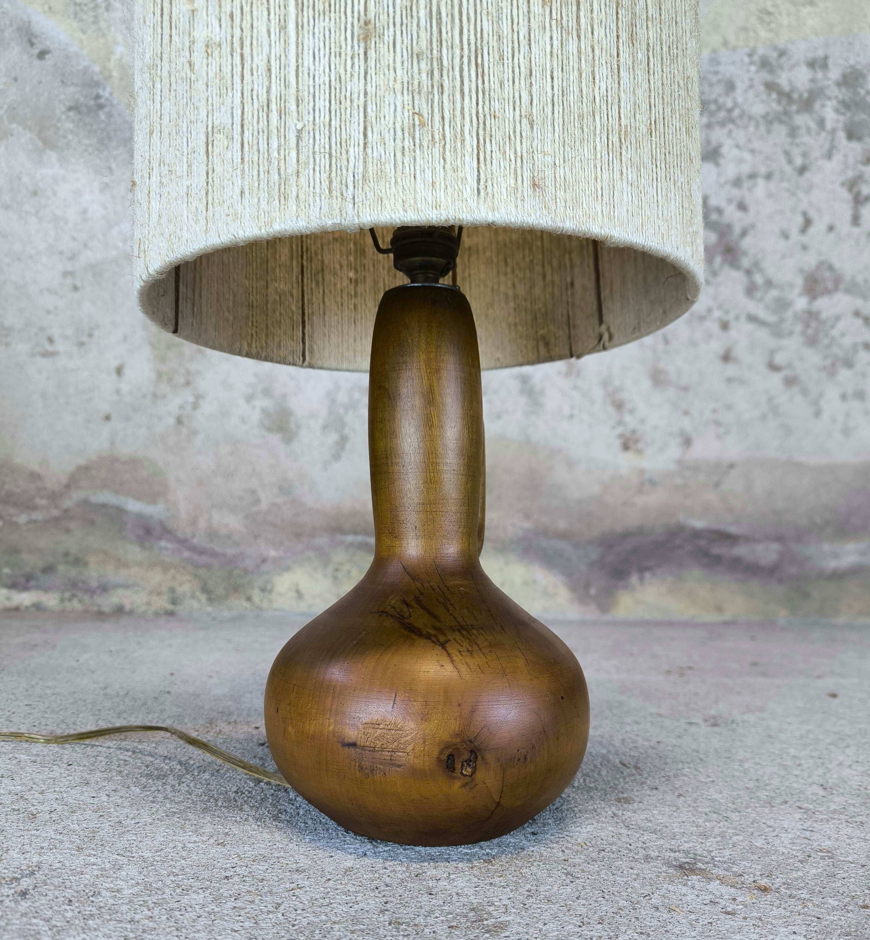 Vintage wooden table lamp with a wool shade.