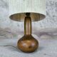 Vintage wooden table lamp with a wool shade.