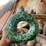 Handmade terracotta donut vase in light green terracotta