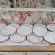 Lot de 12 assiettes plates en porcelaine suisse blanche double liseré doré "VSK USC Viribus Unitis"