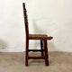 Spanish chair in leather and carved wood, 1950s/60s.