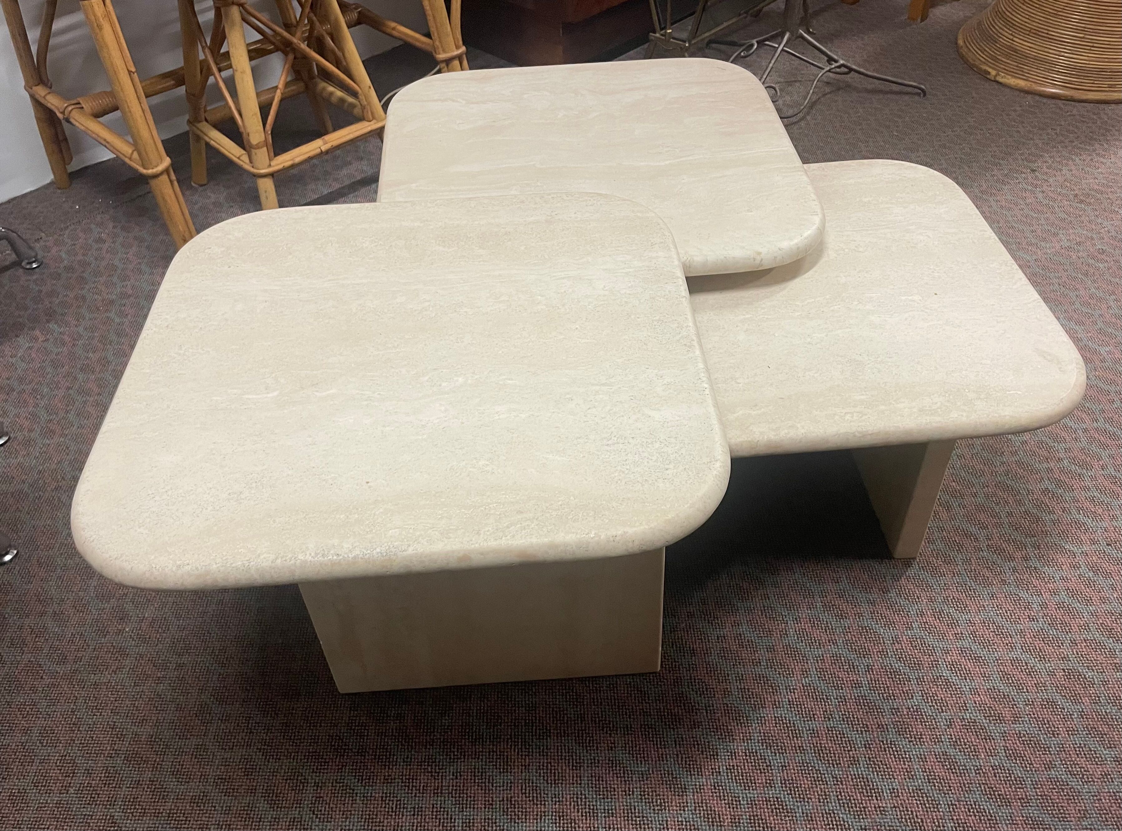 Modular pull-out coffee tables in travertine