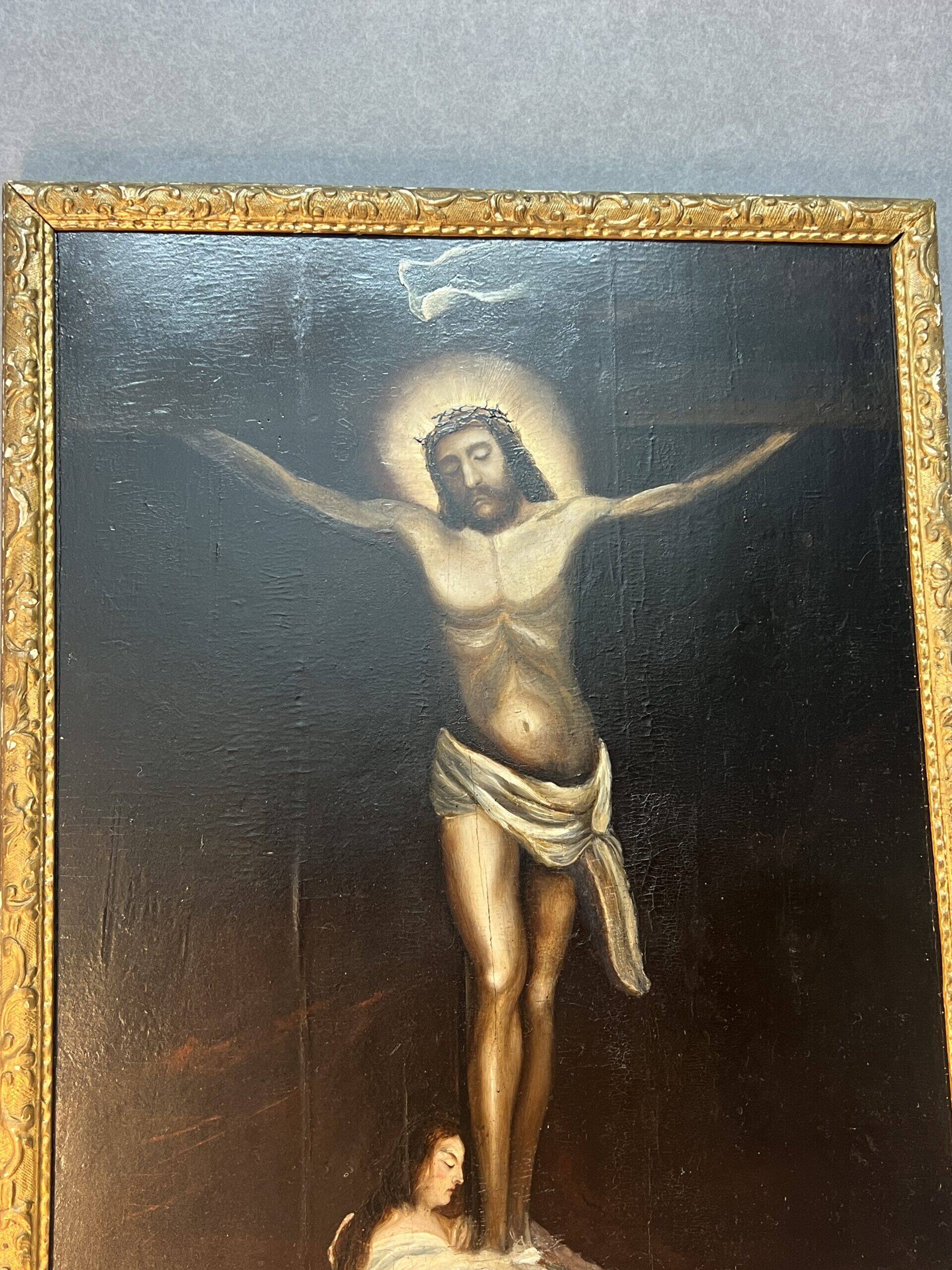 Beautiful religious work from the 17th century, oil on panel representing Christ on his cross with Mary Magdalene at his feet