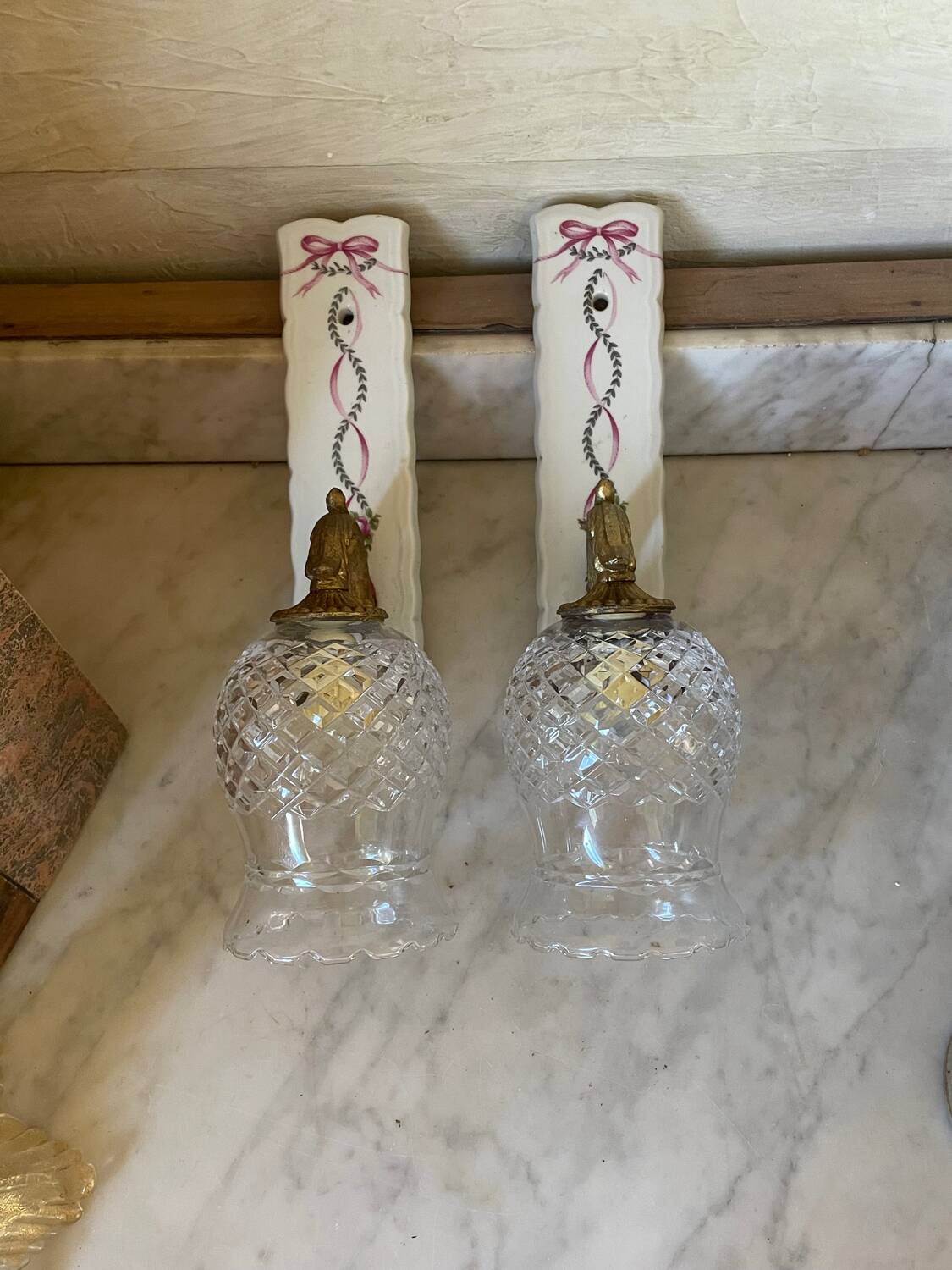 Pair of cut glass and Limoges porcelain wall sconces