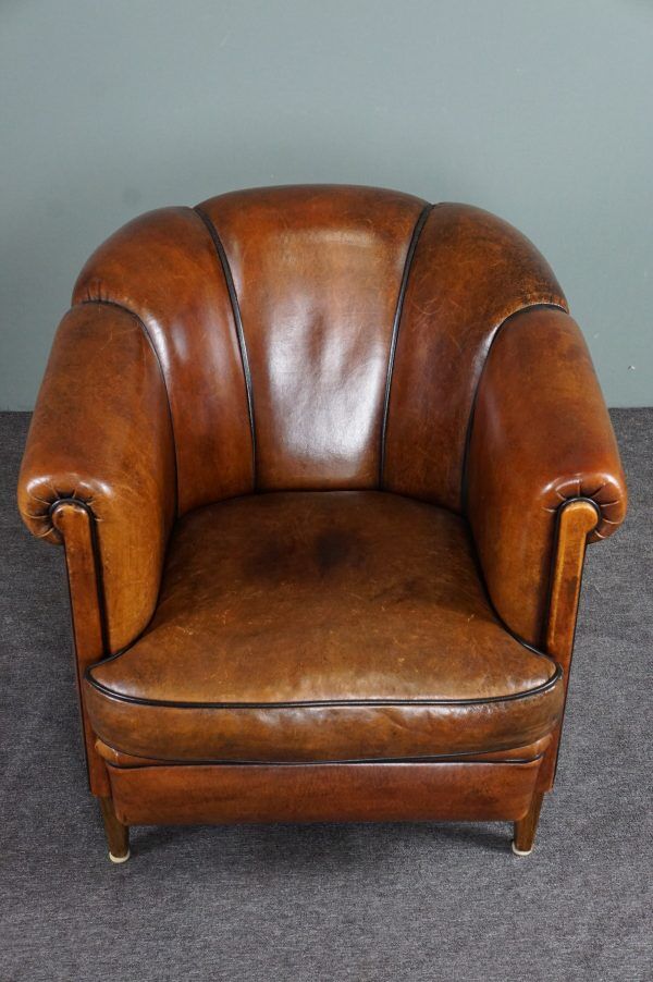 Club armchair in warm coloured sheepskin