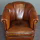 Club armchair in warm coloured sheepskin