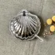 Metal shell butter dish with glass bowl and knife