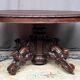 Hunting style dining table with figures of four different animals.