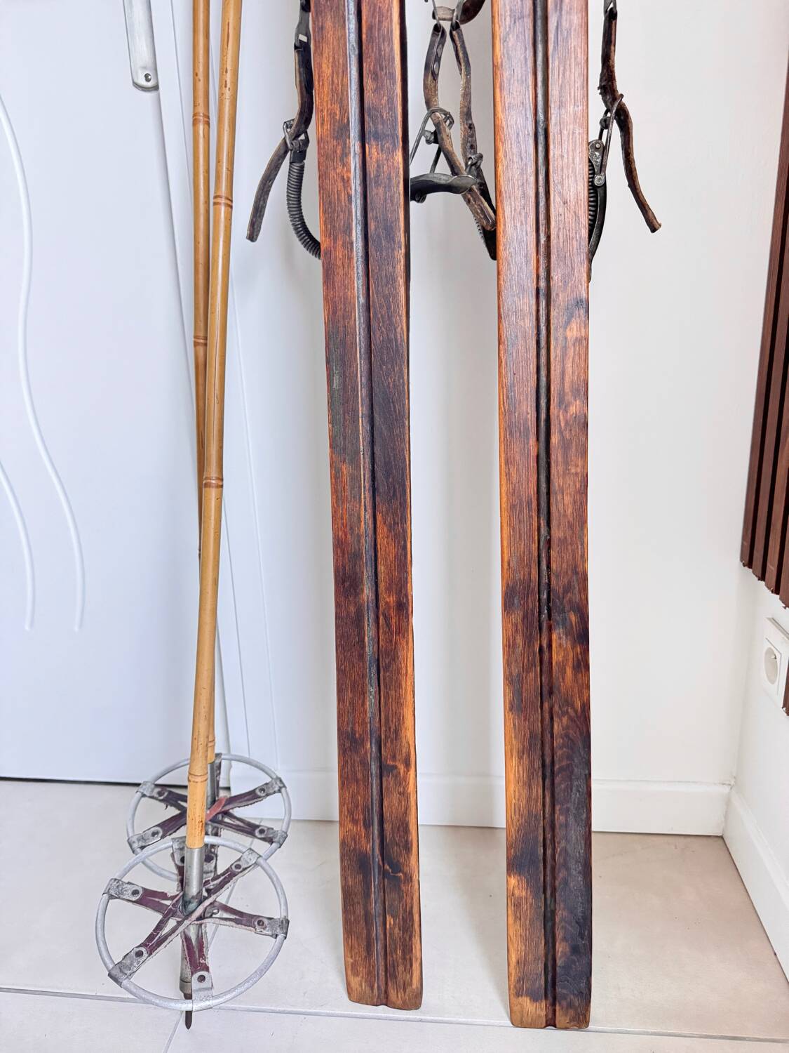 Antique wooden skis with vintage poles