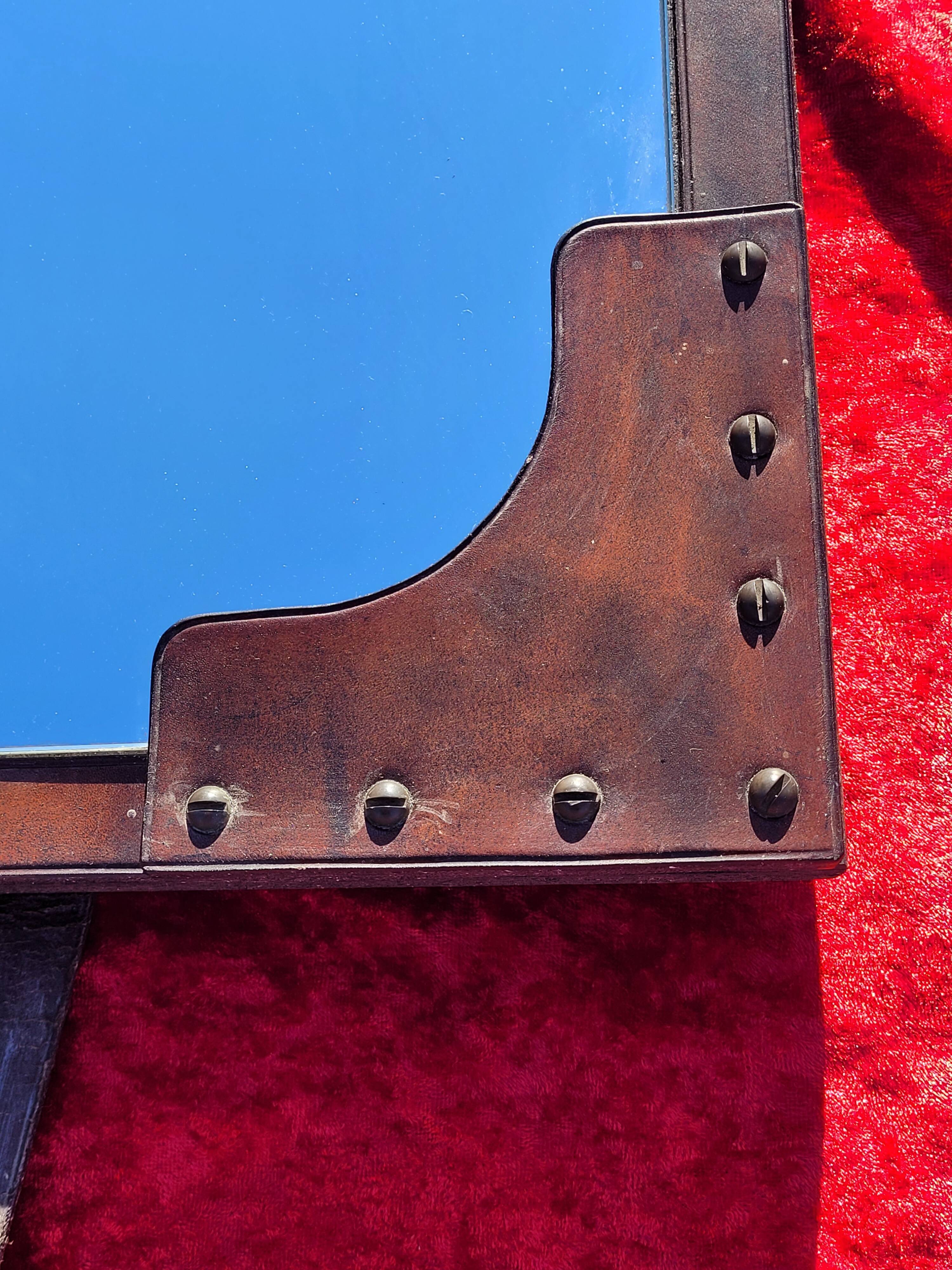 Leather-covered wall mirror attributed to Jacques Adnet 1950