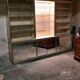Ivory-colored and matte gold anodized aluminum display bookcase