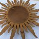 Sun mirror in carved gilded wood from the 1950s