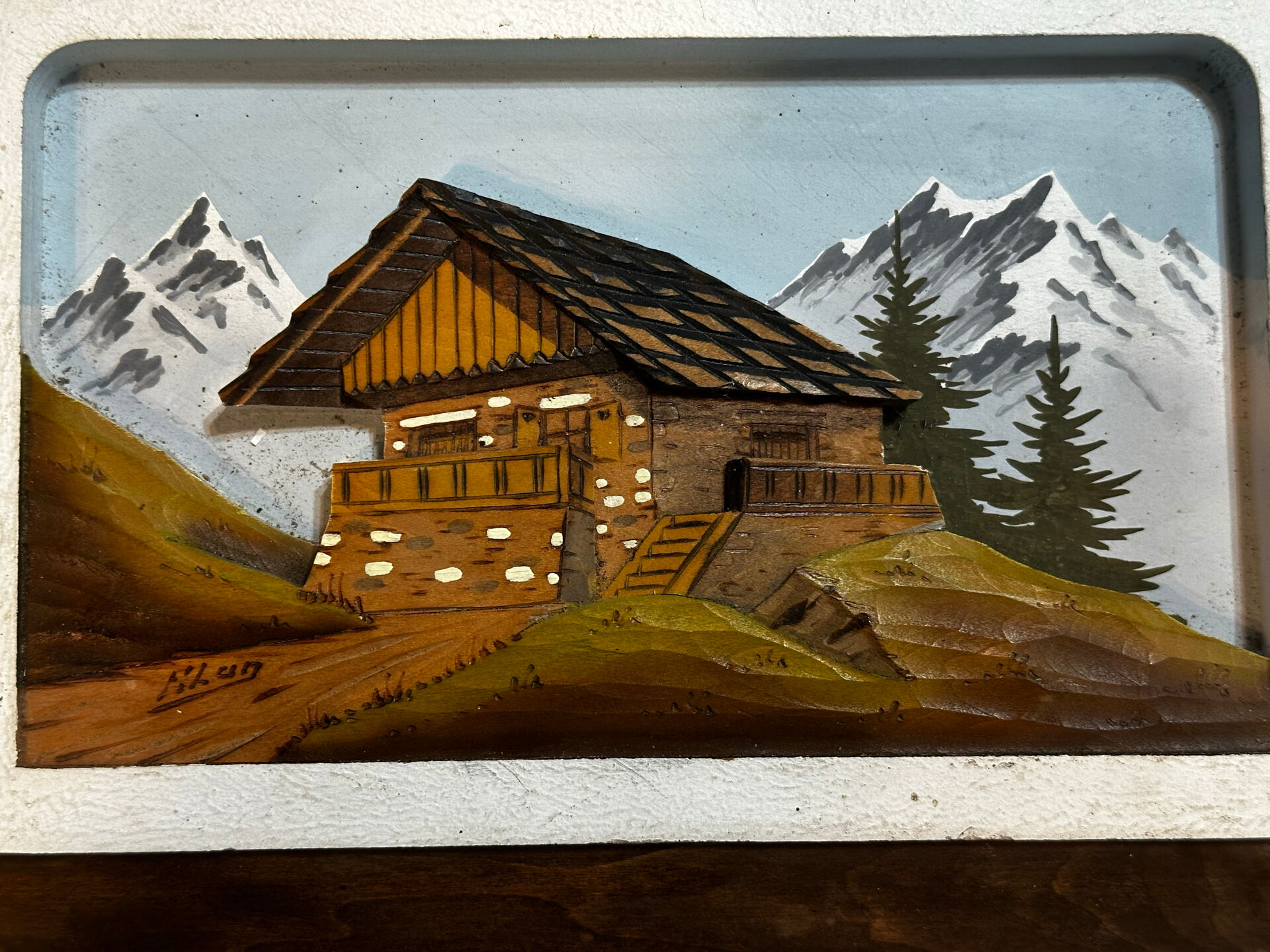 Carved and painted wooden Alpine panel signed 18 / 26 cm