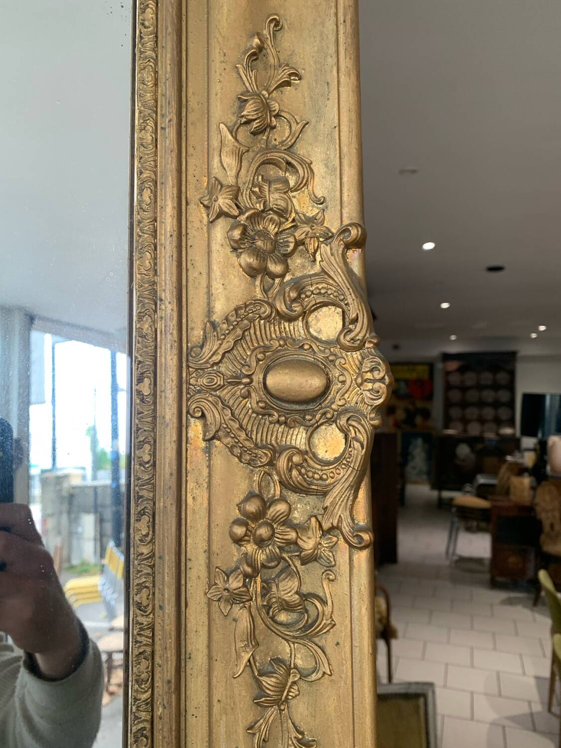 Old gilded mirror fireplace, 19th century restoration