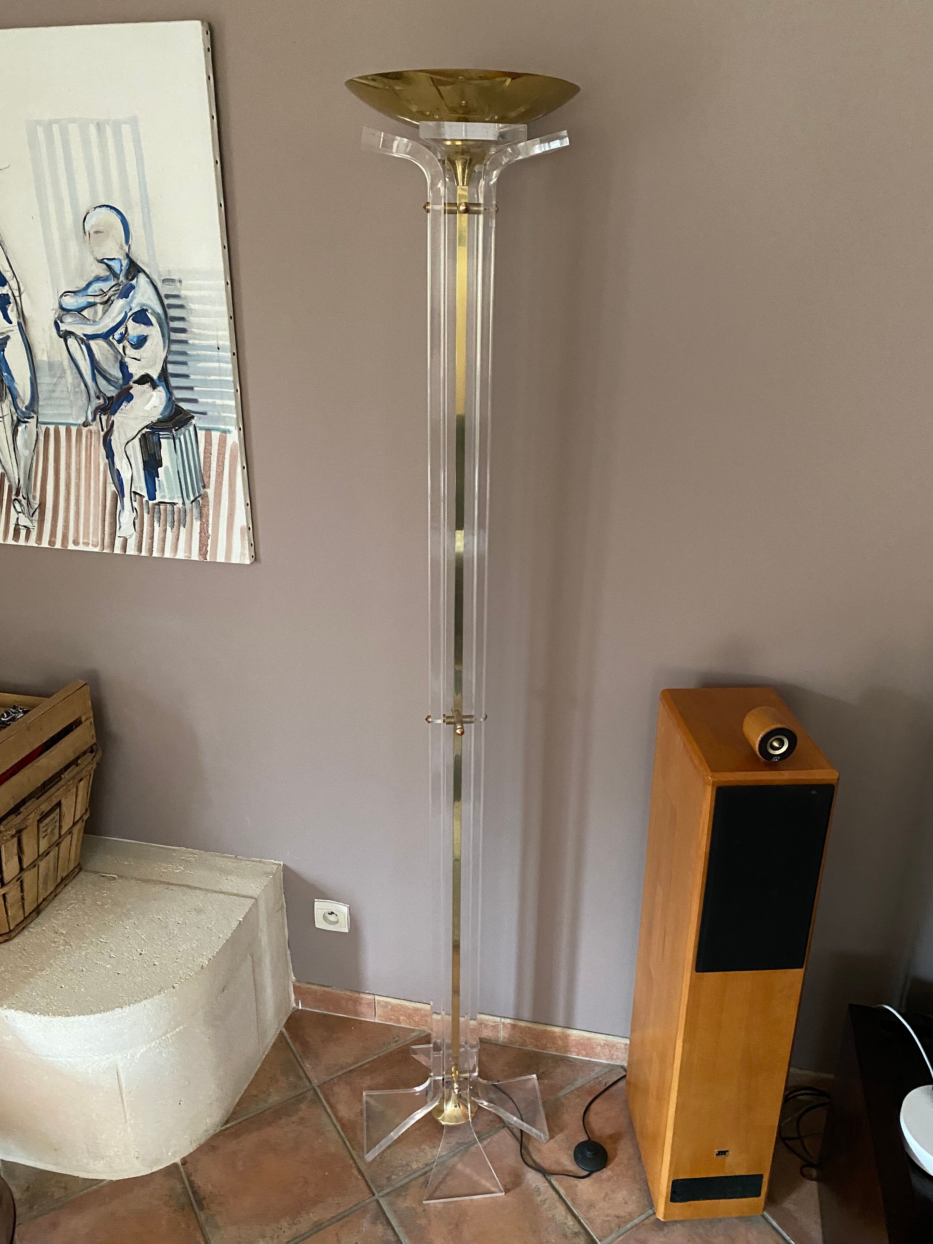 Plexiglass and brass floor lamp. 1970. Italy.