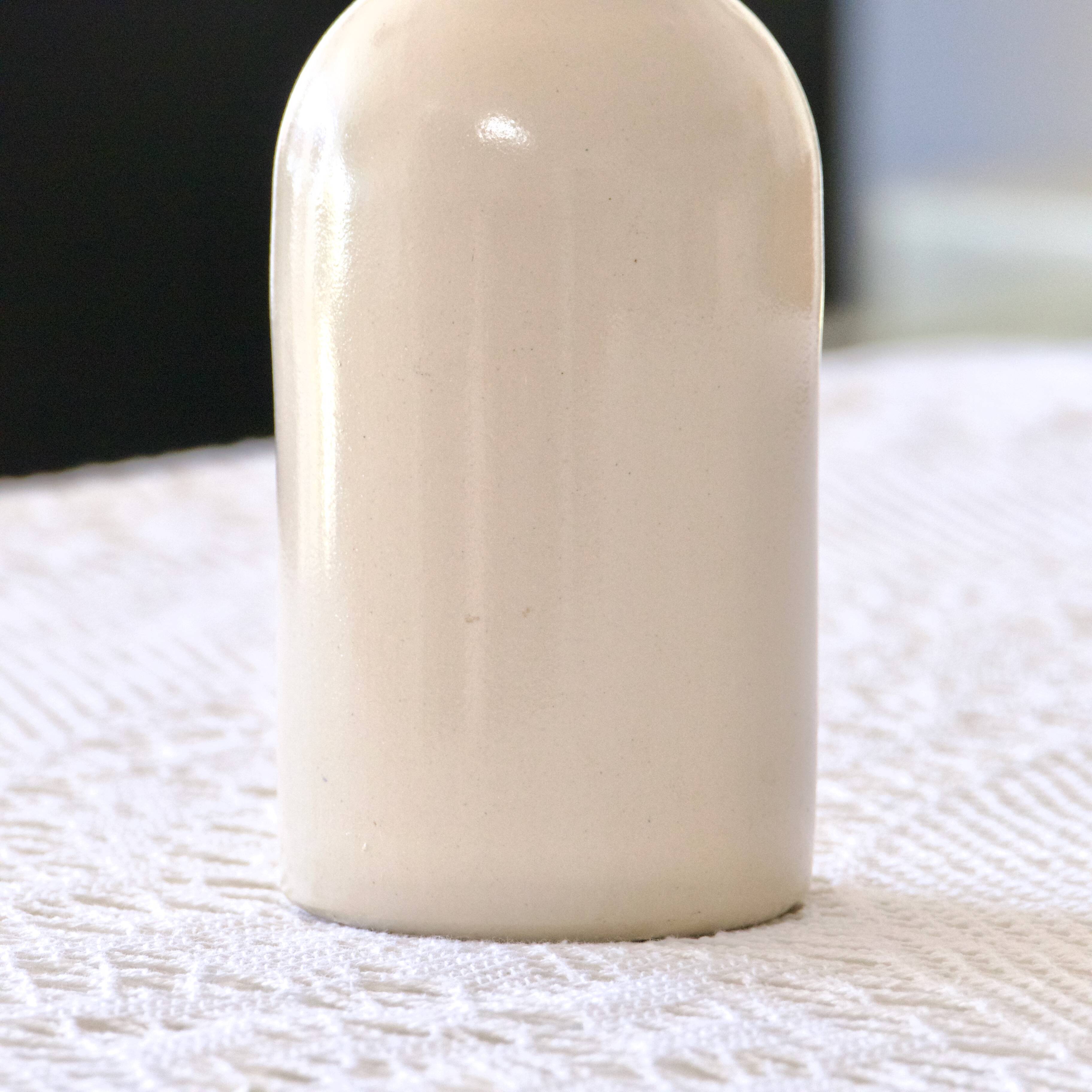 Antique enamelled stoneware beer bottle signed MKM