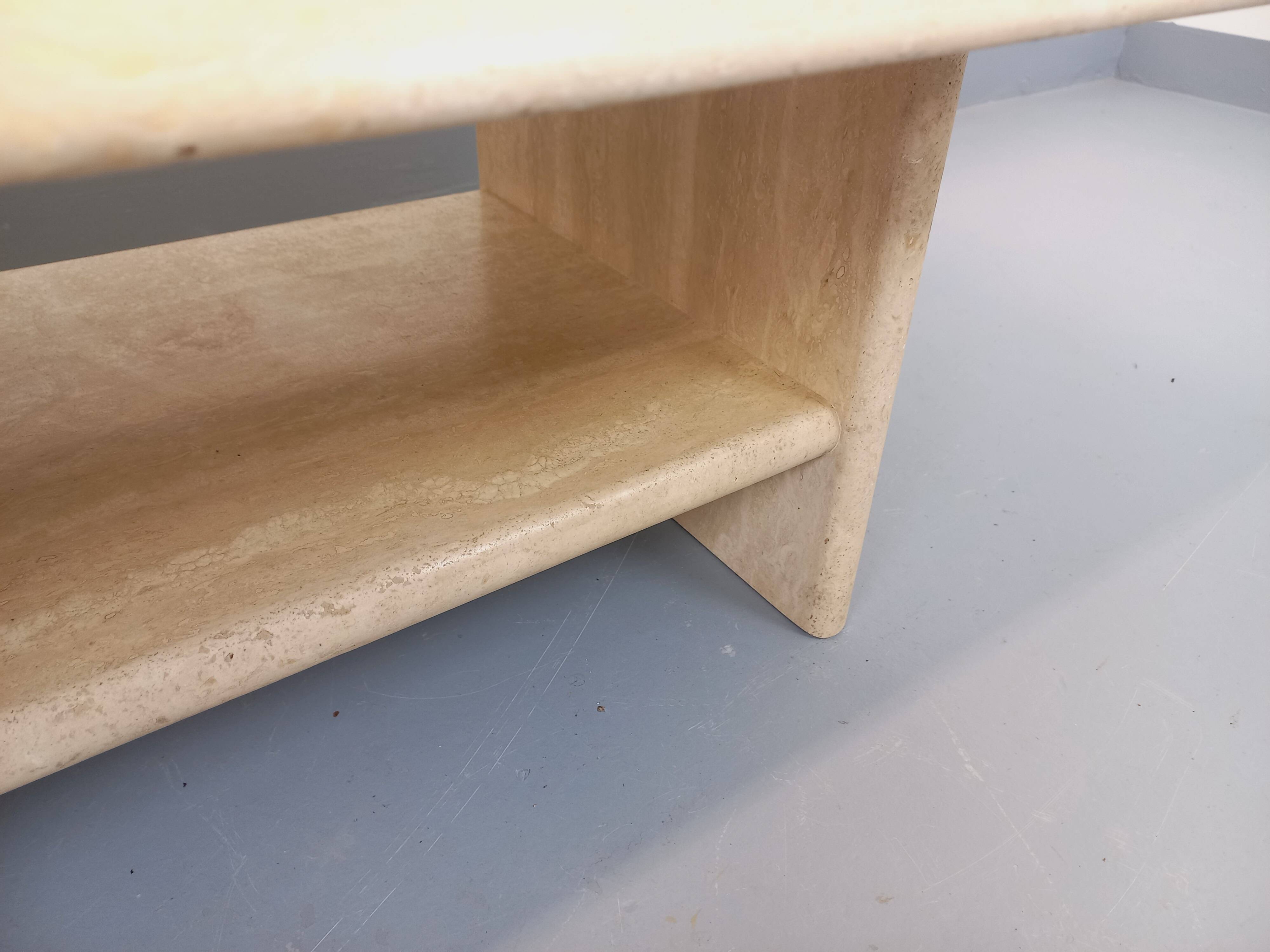 Vintage rectangular coffee table in travertine with magazine rack.