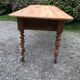 Antique Louis Philippe style farm table in solid cherry wood with 2 drawers and turned base.