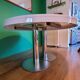 Ligne Roset table in glossy white lacquer, chrome legs, 2 extensions.