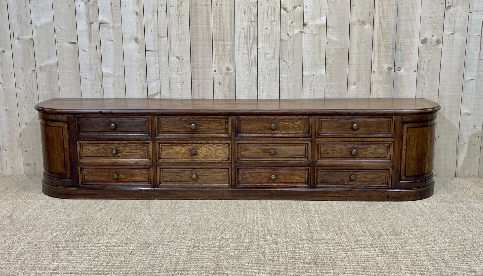 Long low oak countertop with 12 drawers - early XXth
