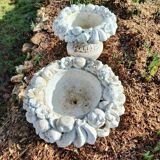 Paire de jardinières rondes sur pied - coupes de fruits en pierre