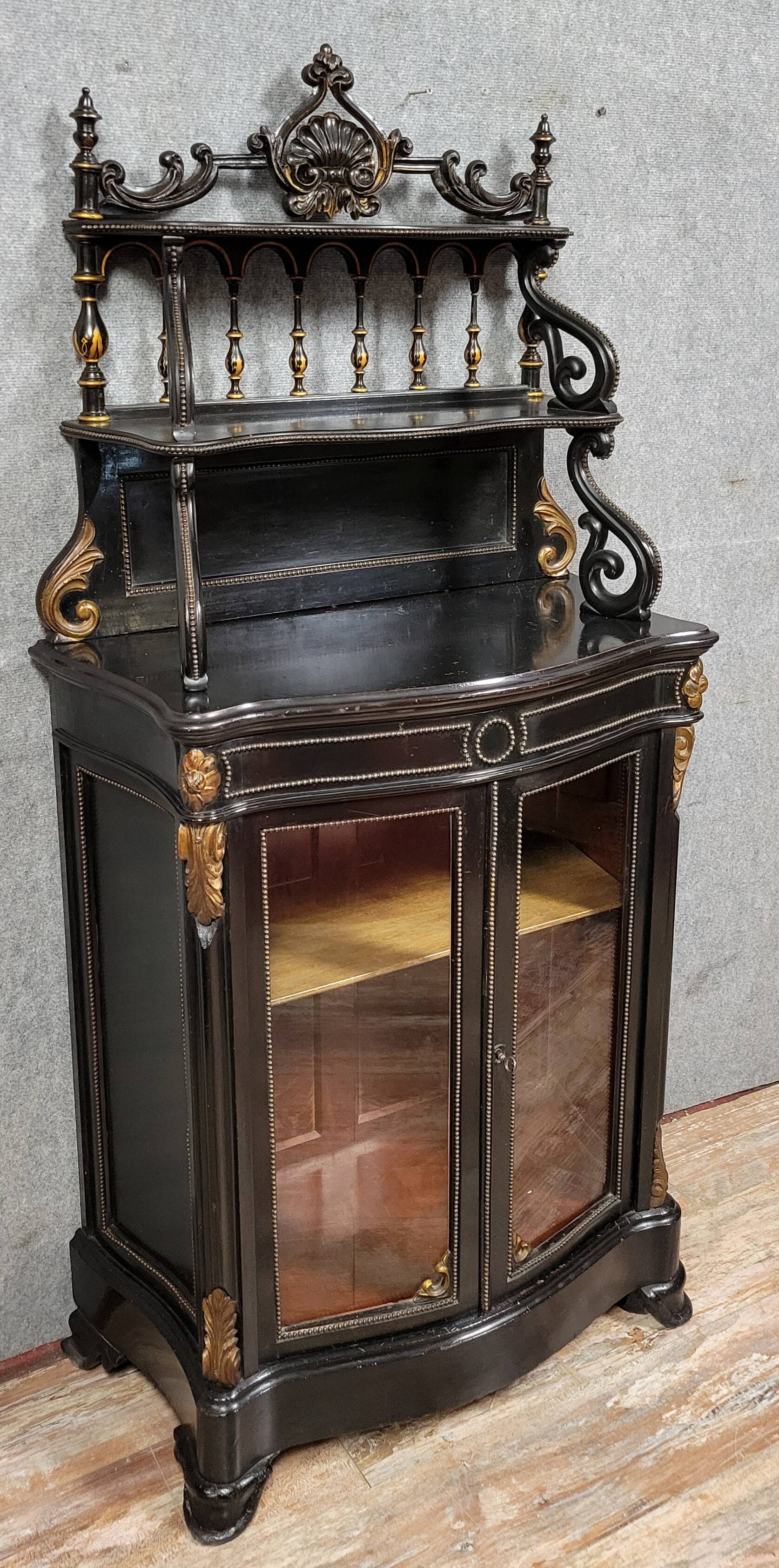 Curved "Boulle" display case from the Napoleon III period in blackened and gilded wood