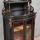 Curved "Boulle" display case from the Napoleon III period in blackened and gilded wood